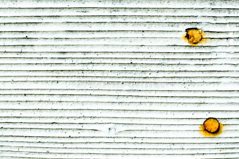 Background texture white wall shingles with rusted nails