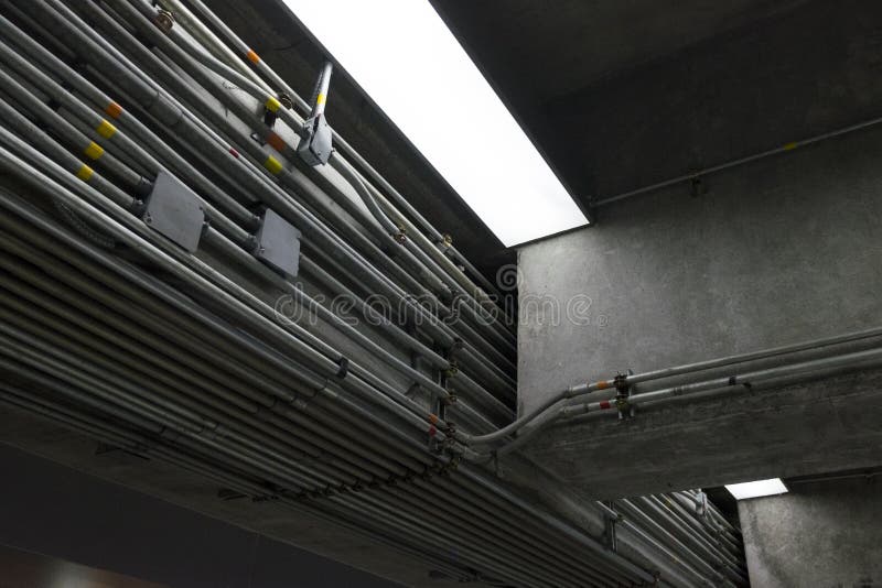 Background and texture of light on ceiling. Cables in steel tube royalty free stock photos