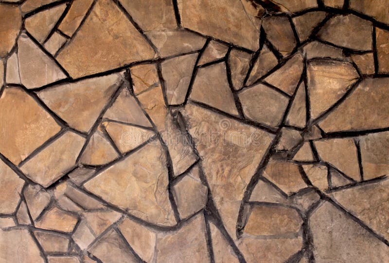 Background texture of a wall of chopped stone stock image