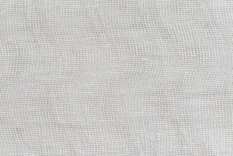 Background Texture of White Medical Bandage. Cheesecloth Texture Stock