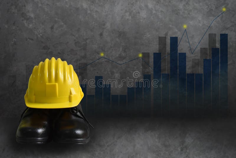 Background wall graphs, statistics Indicates the positive direction. Safety concept in the industry or construction. Foreground is yellow safety helmets and shoes for artisans and empty space for text. Background wall graphs, statistics Indicates the positive direction. Safety concept in the industry or construction. Foreground is yellow safety helmets and shoes for artisans and empty space for text.