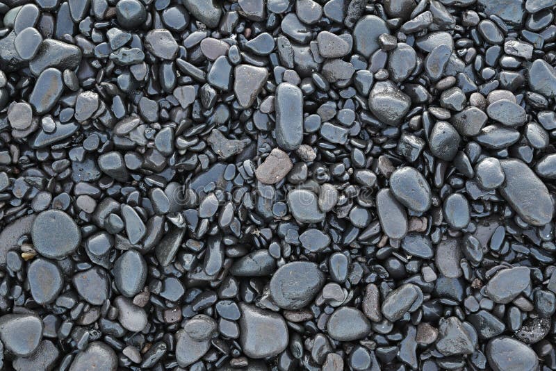Background of wet black pebbles