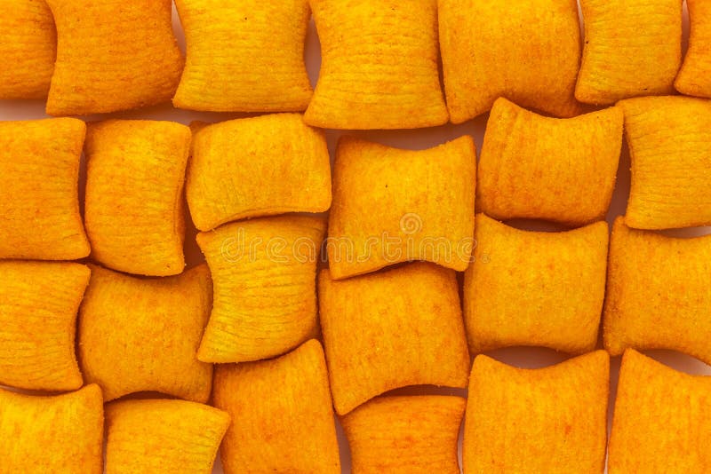 Background of Wheat and Corn Chips with a Taste of Cheese in the Form