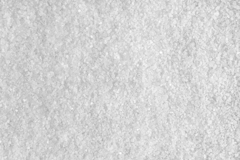 Background from white sea salt. Coarse rock salt texture