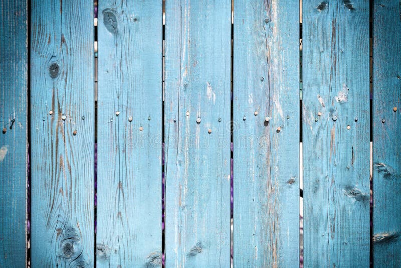 Background of wooden slats dyed in bright blue. Fence of flat boards. royalty free stock photography Background of wooden slats dyed in bright blue. Fence of flat boards. royalty free stock photography