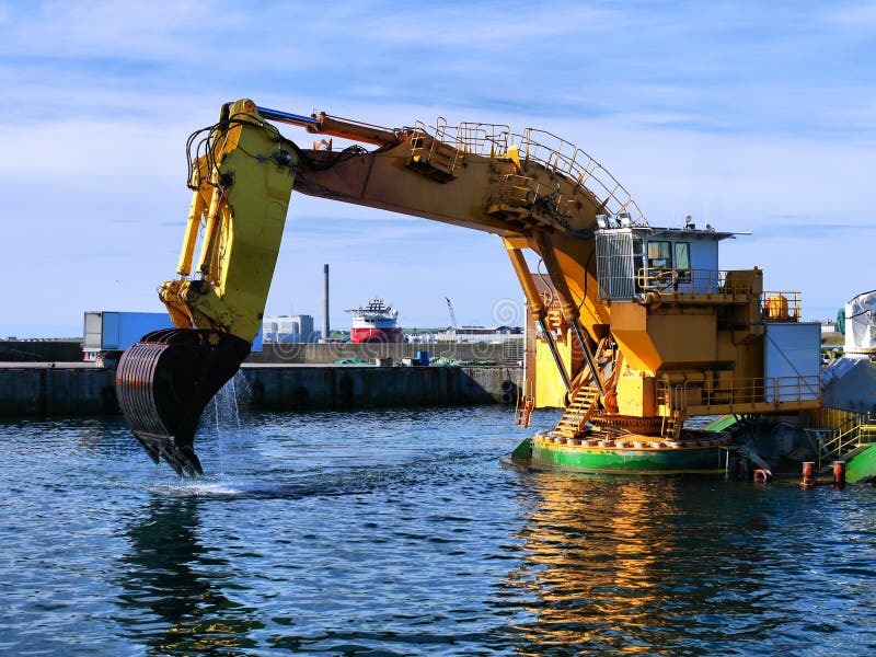 Backhoe Dredger Working In Harbour.