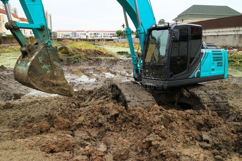 Green Backhoe Working on Dirt Stock Image Image of wheel, crawler