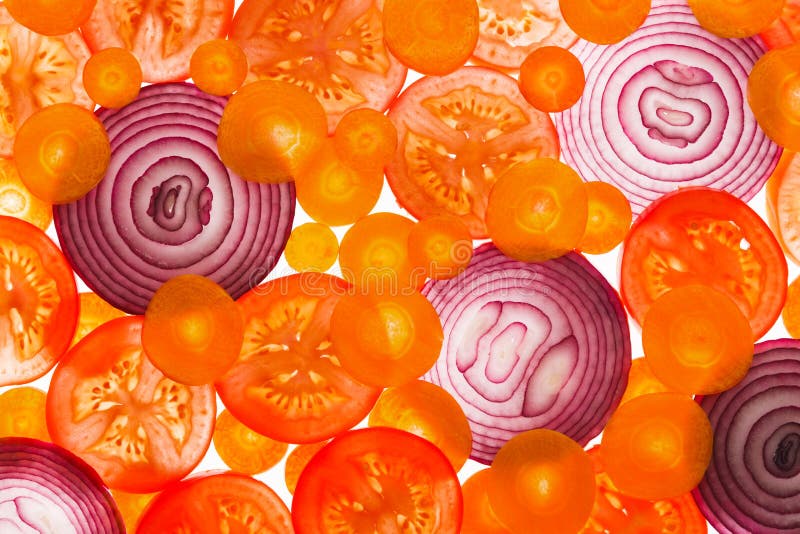 Backlit slices of tomatoes, carrots and onion stock photos Backlit slices of tomatoes, carrots and onion stock photos