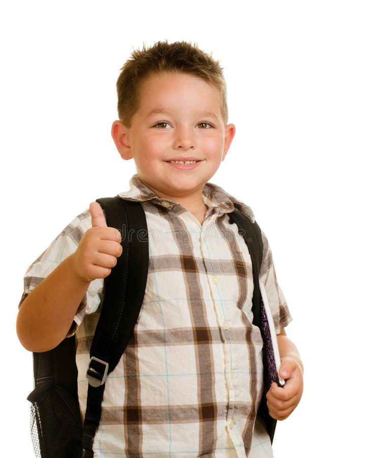 Backpack счастливого школьника нося давая большие пальцы руки вверх стоковая фотография rf