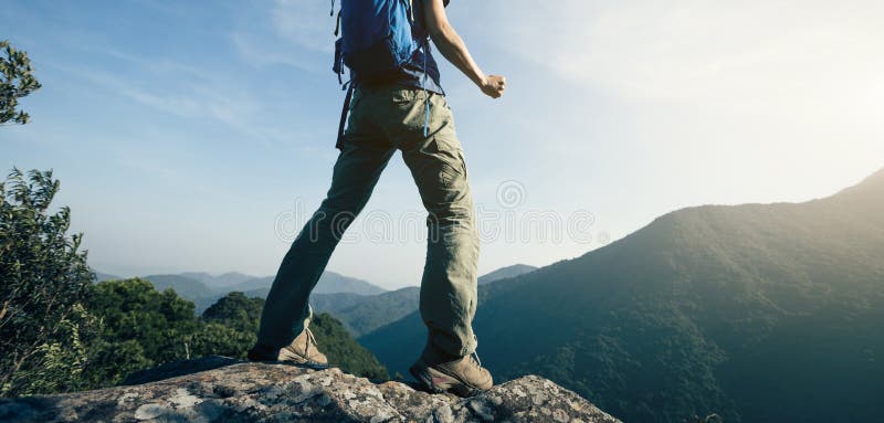 Backpacker enjoy the view cliff edge royalty free stock photography