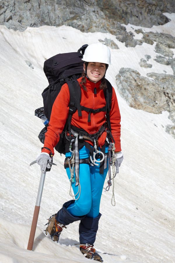 Backpacker girl with ice-axe