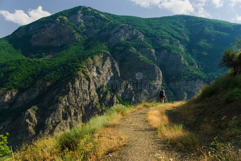 Backpacker hiking in the majestic Armenian mountains in the summer, Tatev, Armenia