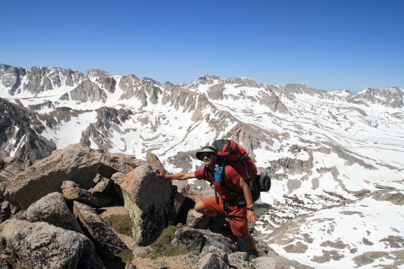 Backpacker near summit stock images