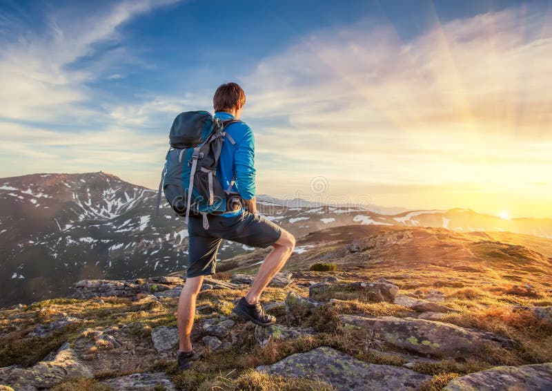 Backpacker on top of a mountaine