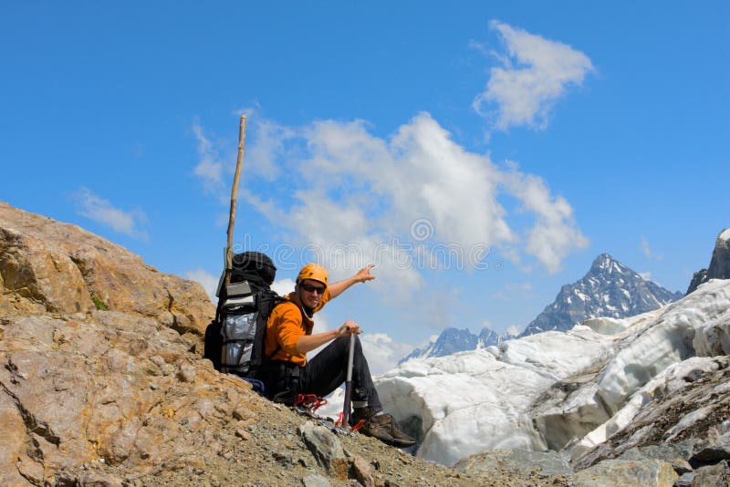 Backpacker tourist in mountains royalty free stock photography