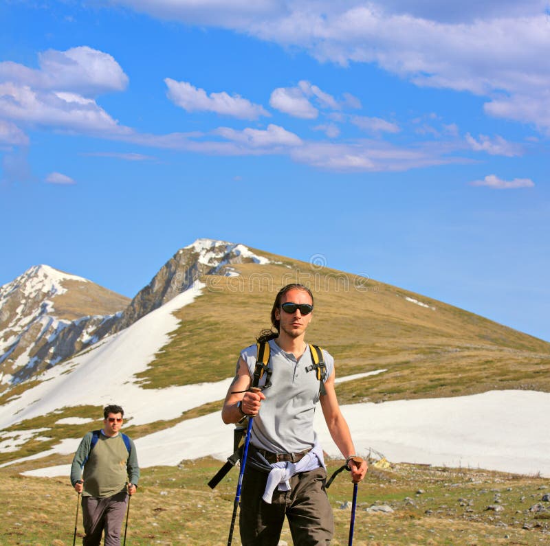 Backpackers on a mountain royalty free stock image