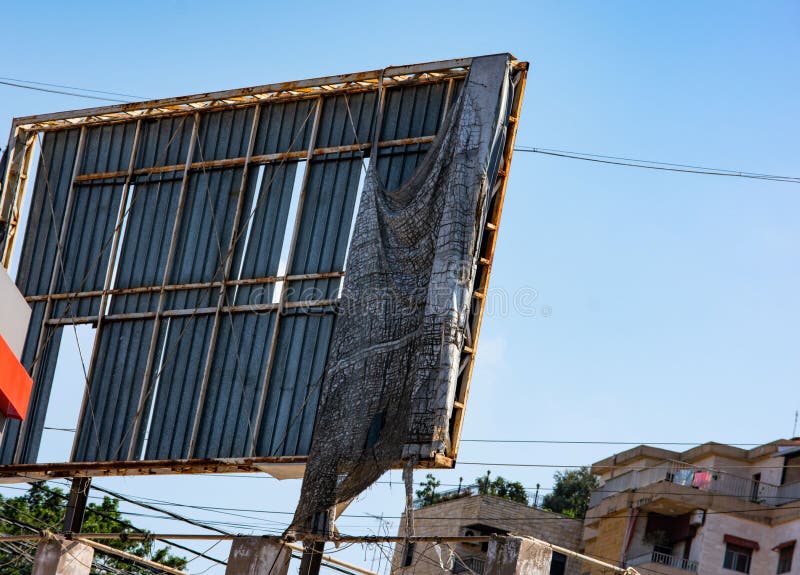 Backside of a large damaged billboard in a Lebanese village. Backside of a large damaged billboard in a Lebanese village