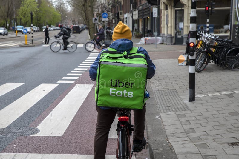 Backside Uber Eats Delivery Man at Amsterdam the Netherlands 642022