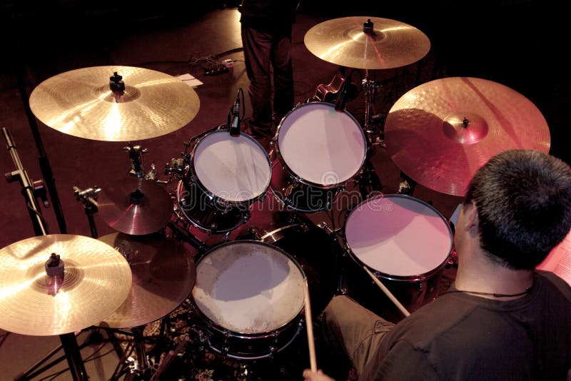 A backstage view from a musician playing drums during a live show. A backstage view from a musician playing drums during a live show