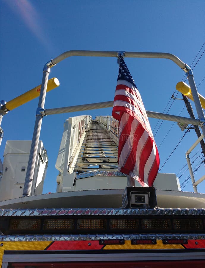 An American flag hangs patriotically on the back of a fire truck in Rutherford, New Jersey, USA. Below the flag, a backup camera. This photo was taken on September 25th 2016. An American flag hangs patriotically on the back of a fire truck in Rutherford, New Jersey, USA. Below the flag, a backup camera. This photo was taken on September 25th 2016.