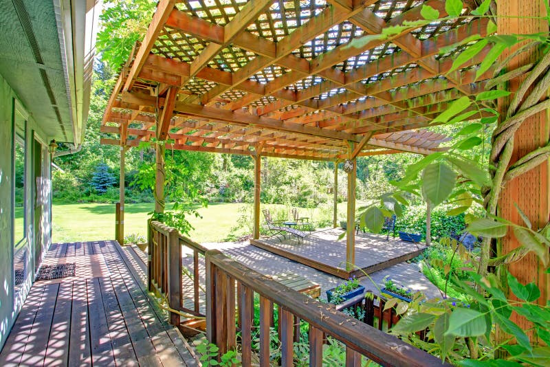 Backyard Farm Deck With Attached Open Pergola Stock Photo 