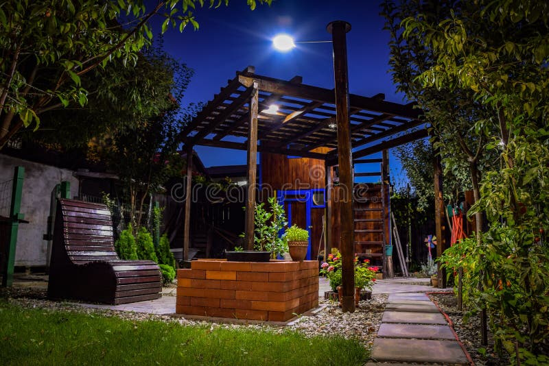 Backyard garden at night stock photo. Image of night 183461958
