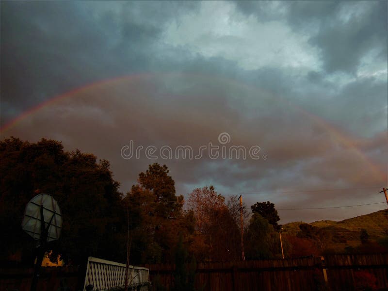 Backyard Rainbow stock image. Image of night, cloud 273411013