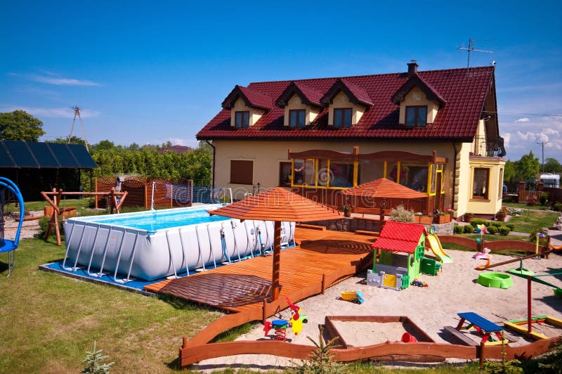 Backyard with swimming pool and sandbox royalty free stock photos