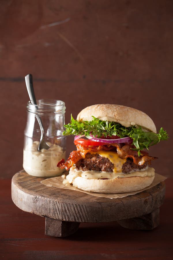 Bacon Cheese Burger with Beef Patty, Tomato and Onion Stock Photo