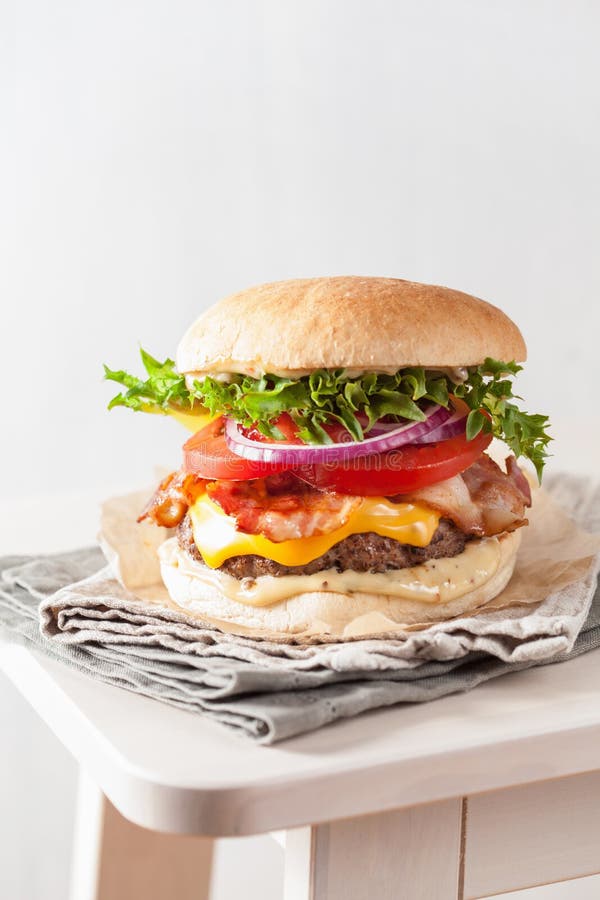 Bacon Cheese Burger with Beef Patty, Tomato and Onion Stock Image