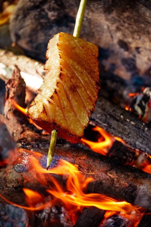 Bacon on Fire , Barbecue in Nature , Cooking , Baked Bacon Stock Image