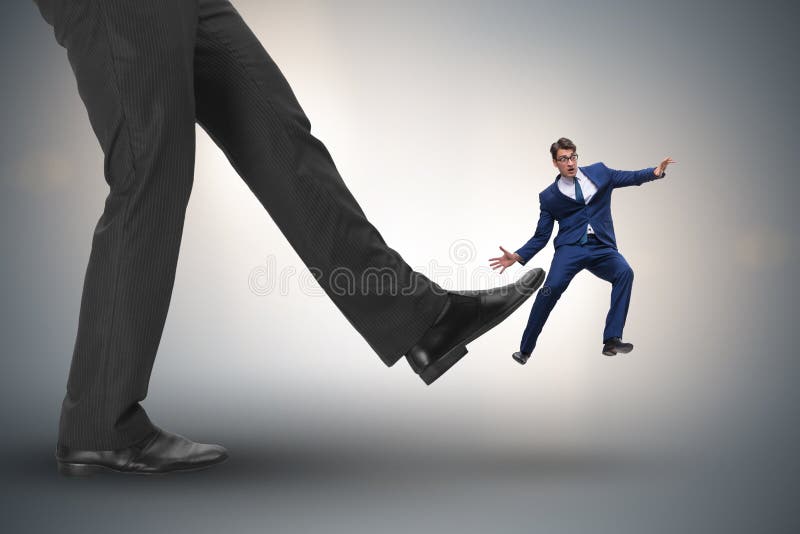 The bad angry boss kicking employee in business concept royalty free stock image