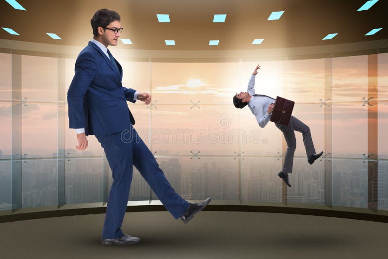 The bad angry boss kicking employee in business concept stock photo