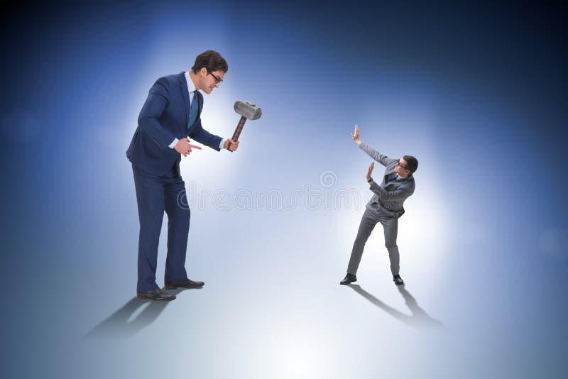 The bad angry boss threatening employee with hammer stock photography