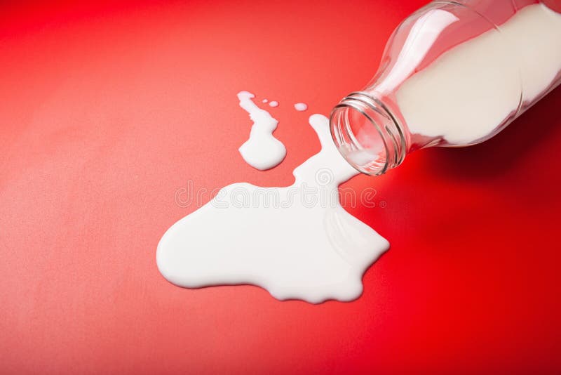 Bad Milk Lactose Intolerance Allergy. Milk Bottle Splatter Stock Photo