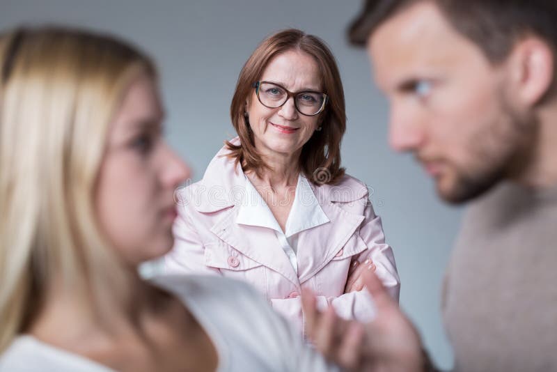 Bad mother-in-law and her son arguing with wife