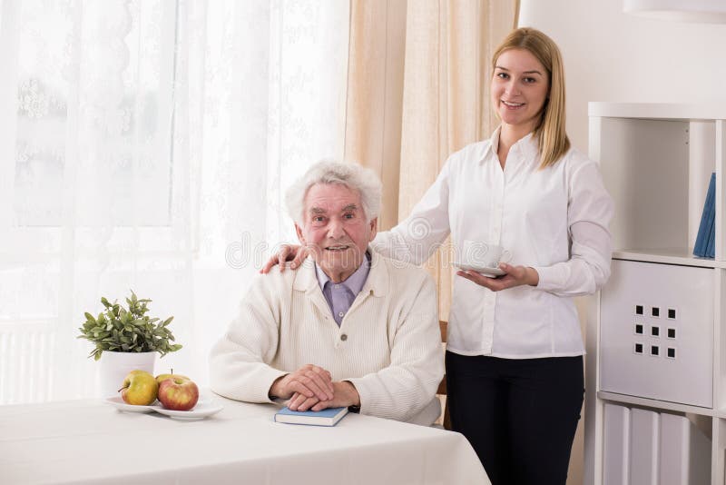 Photo of positive private caregiver and old man. Photo of positive private caregiver and old man