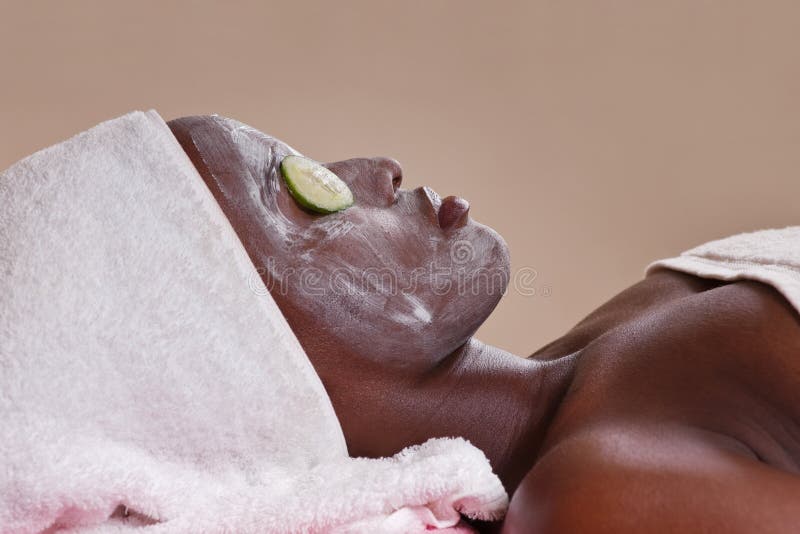 Lifestyle, african american woman having a facial treat at the spa. Lifestyle, african american woman having a facial treat at the spa