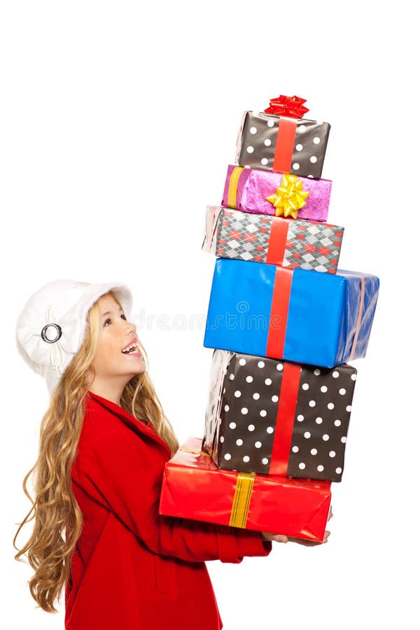 Badinez la fille jugeant beaucoup de cadeaux empilés sur sa main photo stock Badinez la fille jugeant beaucoup de cadeaux empilés sur sa main photo stock