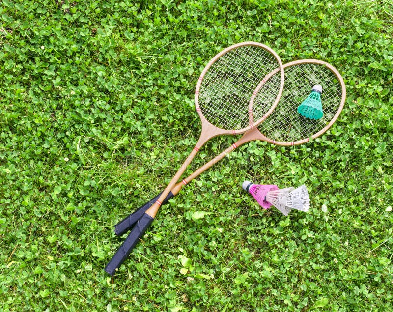 Badminton Rackets and Shuttlecocks on Grass Stock Photo Image of