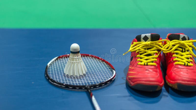 Badminton Red Shoes with Blurred Shuttlecock and Racket on Court Stock ...