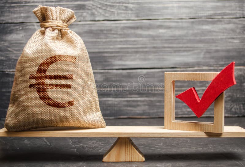 A bag with euro money and a red check mark of a voice on scales. Intervention in the political processes. The concept of services stock image A bag with euro money and a red check mark of a voice on scales. Intervention in the political processes. The concept of services stock image