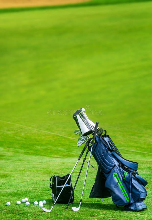 Bag of Golf Clubs on the Golf Course Vertical Copy Space Stock Image