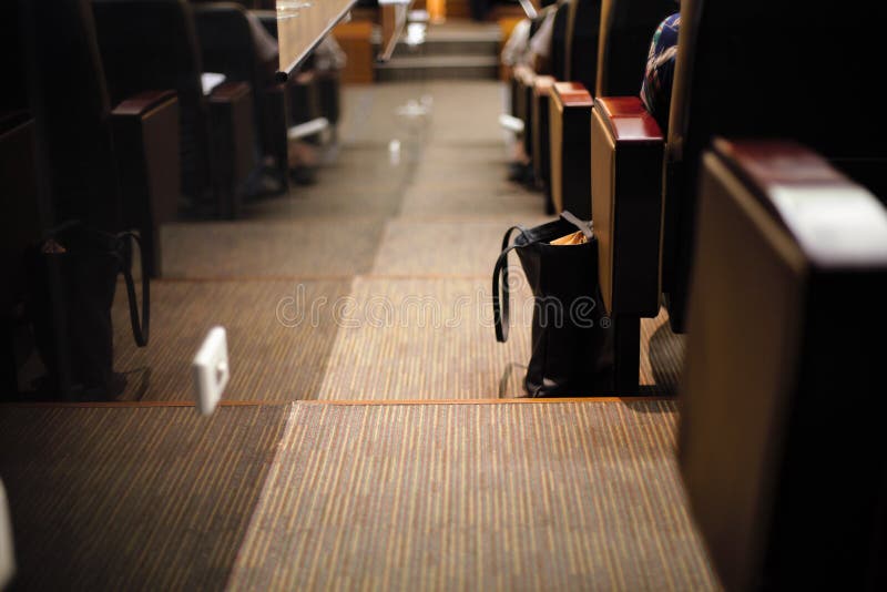 A bag on stariways in a theater