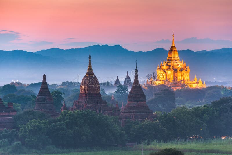 Bagan, Myanmar ancient temple ruins landscape in the archaeological zone at dusk. Bagan, Myanmar ancient temple ruins landscape in the archaeological zone at dusk