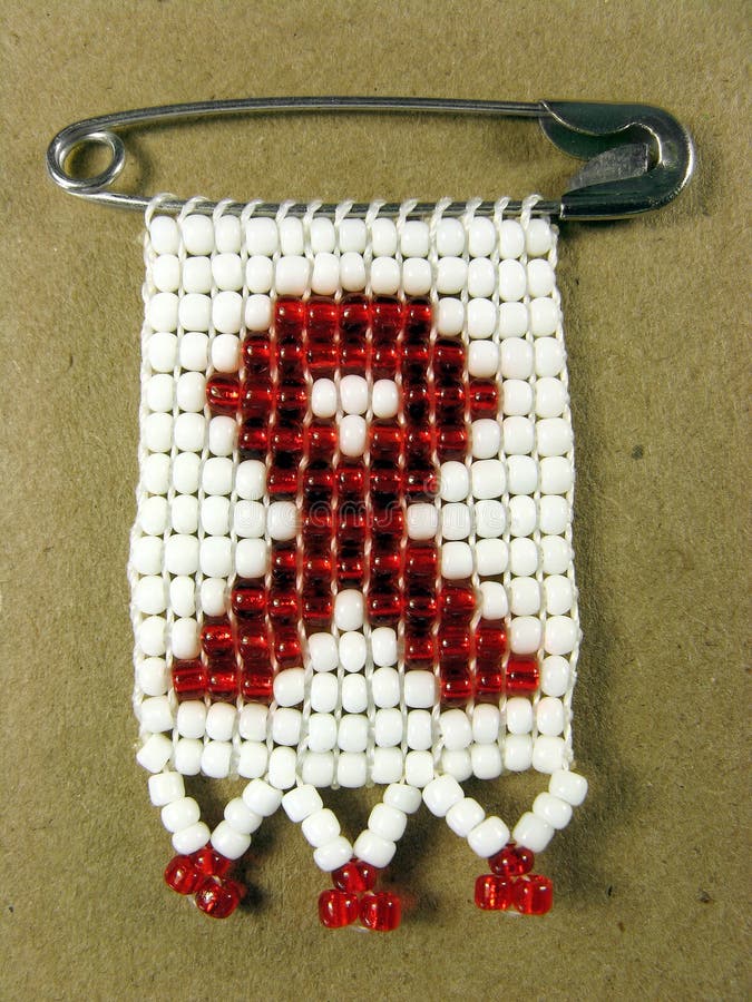 Portrait photo of a traditional african AIDS badge. Portrait photo of a traditional african AIDS badge.