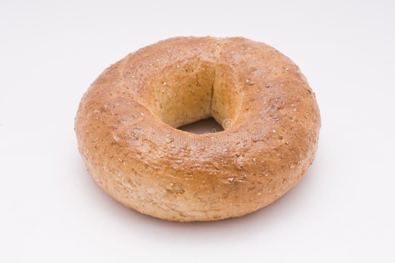 A close up shot of a perfect bagel on white. A close up shot of a perfect bagel on white