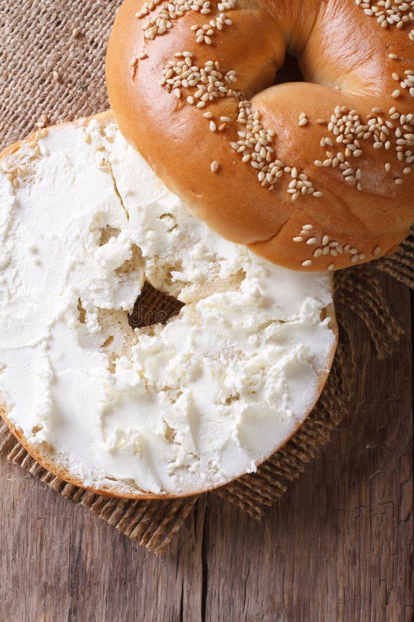 Bagel With Cream Cheese And Sesame Vertical Top View Stock Photo - Image of above, background ...