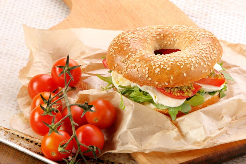 Bagel Sandwich with Mozzarella, Tomato and Pesto Stock Photo - Image of ...