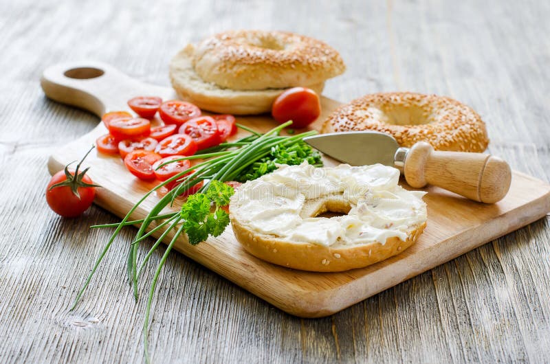 Bagels wtih cream cheese, tomatoes and chives for healthy snack. Bagels sandwiches wtih cream cheese, tomatoes and chives for healthy snack stock images Bagels wtih cream cheese, tomatoes and chives for healthy snack. Bagels sandwiches wtih cream cheese, tomatoes and chives for healthy snack stock images